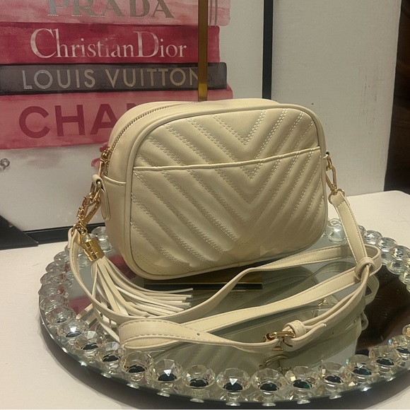 lola mae Handbags - Lola Mae NWOT Chic Cream Crossbody Bag with Tassel